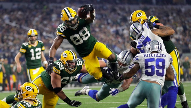 Packers running back Ty Montgomery (88) dives for a touchdown during the second quarter against the Cowboys.
