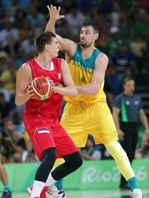 Nikola Jokic, facting off against Australia center Andrew Bogut, is a key in the post for Serbia.