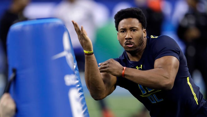 Texas A&M DE Myles Garrett shows off his pass-rushing moves Sunday at the combine.