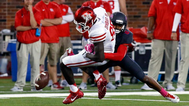 SMU defensive back Horace Richardson breaks up the pass to Houston wide receiver Steven Dunbar during the second quarter at Gerald J. Ford Stadium.