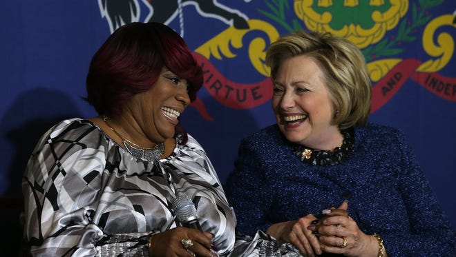 Tanya Brown Dickerson, whose son was killed by police, shares a laugh with Democratic presidential candidate Hillary Clinton during an April 20, 2016 panel discussion.