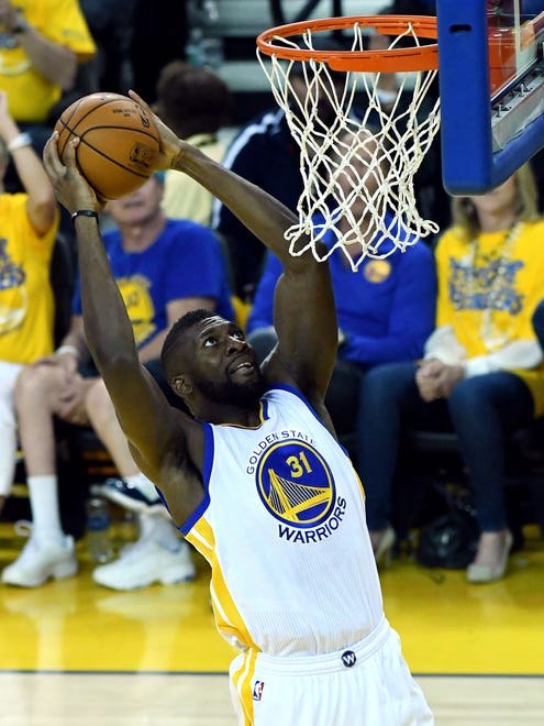 Golden State Warriors center Festus Ezeli (31) dunks the ball during the second quarter against the Cleveland Cavaliers in game one of the NBA Finals at Oracle Arena.