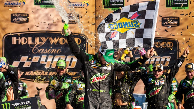 Chase Elliott sprays Mountain Dew in Kansas Speedway victory lane after winning his second playoff race of the 2018 season.