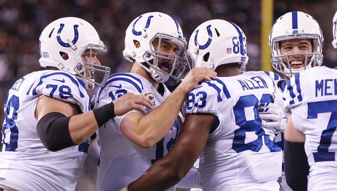 Indianapolis Colts tight end Dwayne Allen (83) celebrates with quarterback Andrew Luck (12) after the pair connected on a 21 yard touchdown pass against the New York Jets during the first quarter at MetLife Stadium in East Rutherford, N.J., on Monday, Dec. 5, 2016. The touchdown was the 2nd of the first half for the pair.