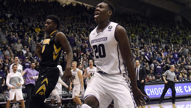 Northwestern Wildcats guard Scottie Lindsey (20) reacts after dunking against the Iowa Hawkeyes during the second half at Welsh-Ryan Arena.