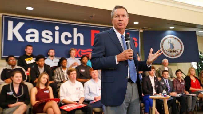 Kasich gestures during a town hall meeting at the University of Richmond in Richmond, Va., on Oct. 5, 2015.