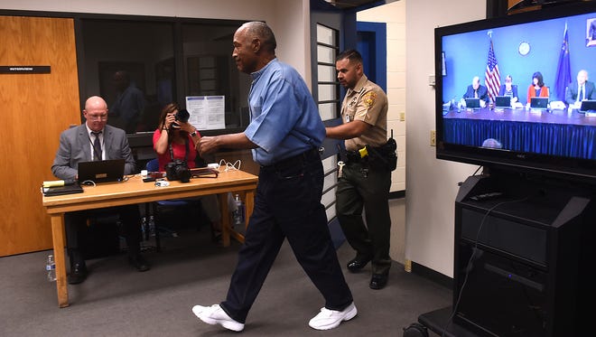 O.J. Simpson enters the room during a parole hearing at Lovelock Correctional Center. Simpson is serving a nine to 33 year prison term for a 2007 armed robbery and kidnapping conviction.