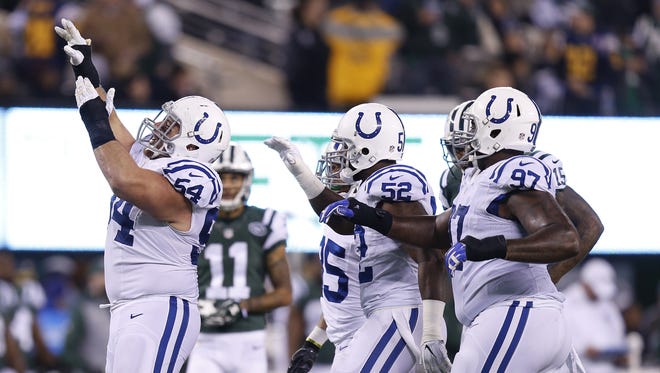 Indianapolis Colts nose tackle David Parry (54), left, celebrates after sacking New York Jets quarterback Bryce Petty (9) during the 2nd half at MetLife Stadium in East Rutherford, N.J., on Monday, Dec. 5, 2016.