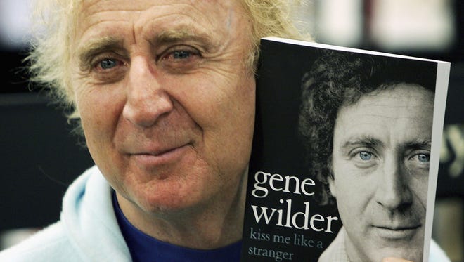 Gene Wilder poses with his autobiography 'Kiss Me Like A Stranger' at a book signing June 7, 2005, at Waterstone's in London. The memoir gives insight into Wilder's failed love life, his experiences of working with stars such as Richard Pryor and Woody Allen, his fight with cancer, and his time in the U.K. studying acting at the Bristol Old Vic.