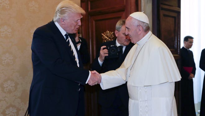 Pope Francis shakes hands with President Trump on the occasion of their private audience at the Vatican in Vatican City, May 24, 2017.