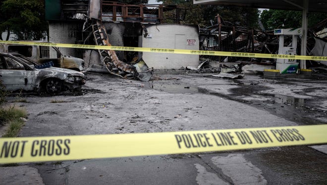 A gas station stands in ruins in Milwaukee, Wisconsin, August 15, 2016 after police in the Midwestern city faced off with protesters August 13 and 14 following the death of 23-year-old Sylville Smith, who officials say was armed.