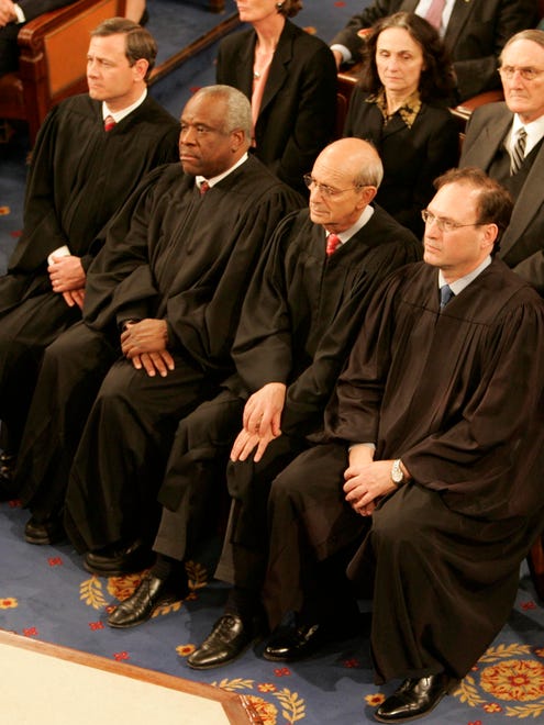 Chief Justice John Roberts and Associate Justices Thomas, Stephen Breyer and Samuel Alito listen to President George W. Bush deliver his State of the Union Address on Jan. 31, 2006.