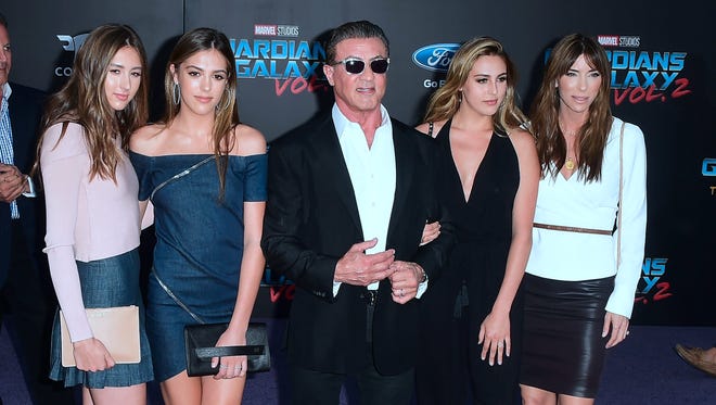 Sylvester Stallone arrives with his wife, Jennifer Flavin (R) and daughters, (L-R) Scarlet, Sistine, and Sophia, for the premiere of 'Guardians of the Galaxy Vol. 2.'