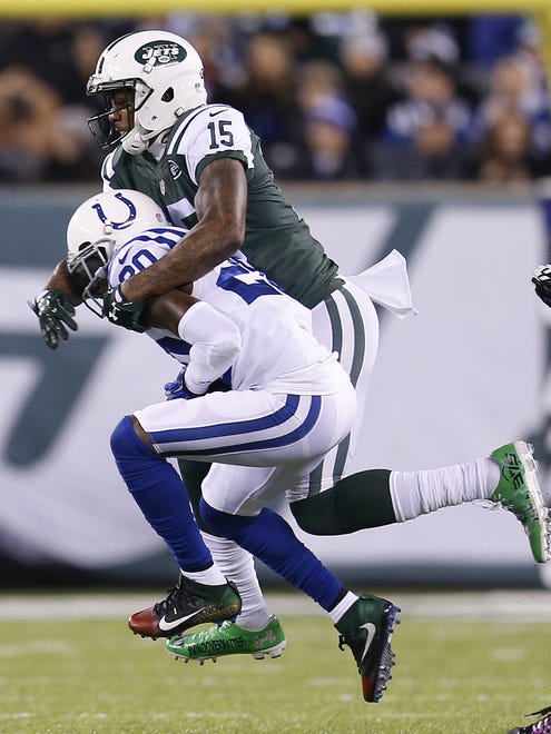 Indianapolis Colts cornerback Darius Butler (20) intercepts a pass intended for New York Jets wide receiver Brandon Marshall (15) during the 1st half at MetLife Stadium in East Rutherford, N.J., on Monday, Dec. 5, 2016.