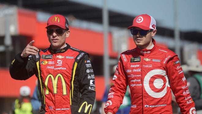 Kyle Larson, right, leads the NASCAR Cup Series standings, while teammate Jamie McMurray, left, sits in fifth.