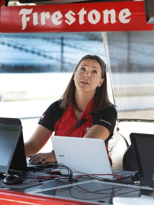 Cara Adams, chief engineer at Firestone, works from their trackside pit box near Gasoline Alley during qualifying for the IndyCar Grand Prix Friday, May 12, 2017, at the Indianapolis Motor Speedway.