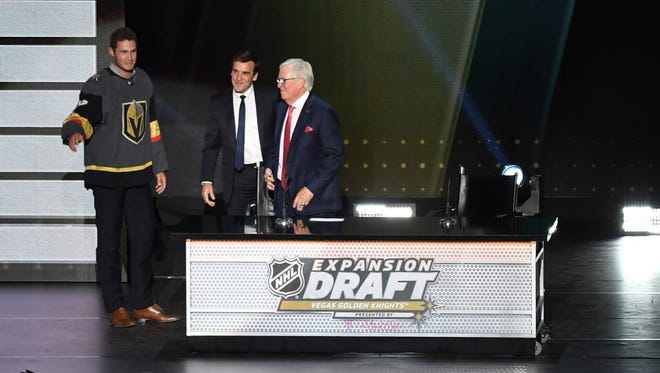 Vegas Golden Knights owner Bill Foley (right) introduces new team member Brayden McNabb during the 2017 NHL Awards and Expansion Draft at T-Mobile Arena.