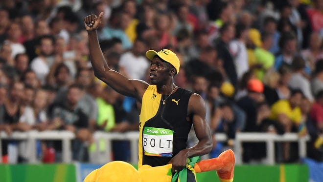 Usain Bolt acknowledges the cheers.