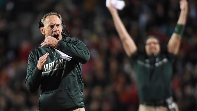 Michigan State's Mark Dantonio yells for a timeout against Maryland in the first half Saturday night in College Park, Md.