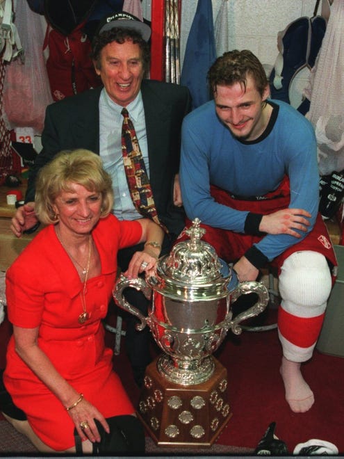 Mike and Marian Ilitch with Sergei Fedorov in the lockerroom with the trophy they won for winning the Western Conference Finals in the fifth game against the Chicago Blackhawks at Joe Louis Arena in 1995.