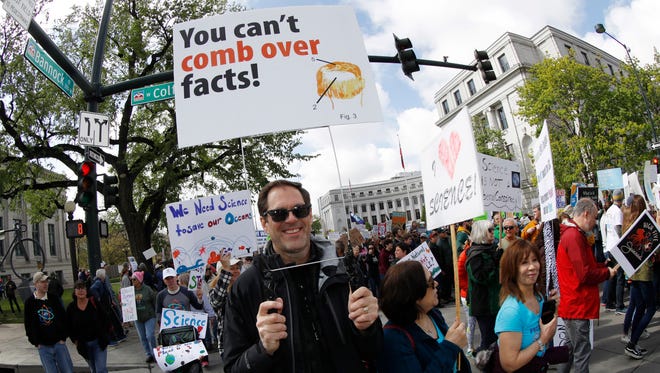 Eric Weber of Denver joins other protesters during a March for Science.