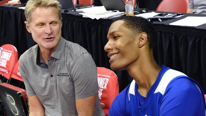 Head coach Steve Kerr (L) of the Golden State Warriors talks with Patrick McCaw #0 of the Warriors after the team defeated the Minnesota Timberwolves 77-69 during the 2017 Summer League at the Thomas & Mack Center on July 12, 2017 in Las Vegas, Nevada.