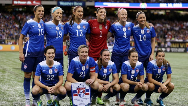 Wambach (20) poses with the rest of the starting lineup before taking the field.