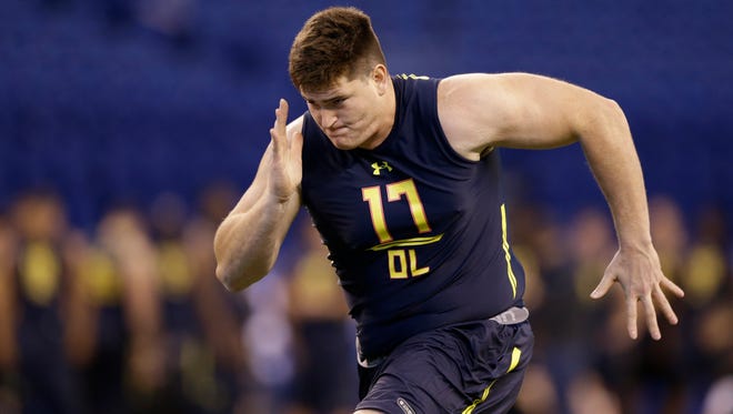 Indiana offensive lineman Dan Feeney runs a drill at the NFL football scouting combine in Indianapolis, Friday, March 3, 2017.