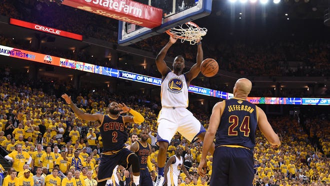 Golden State Warriors forward Harrison Barnes (40) dunks to score a basket against Cleveland Cavaliers during the second half in game one of the NBA Finals at Oracle Arena.