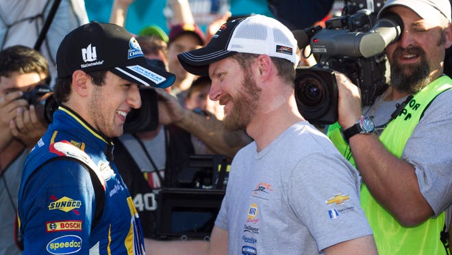 NASCAR driver Chase Elliott is congratulated by Dale Earnhardt Jr. at the end of the DAV 200 Honoring America's Veterans at Phoenix International Raceway in Avondale on Saturday, November 8, 2014.