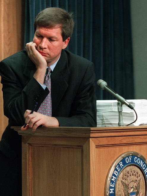 Then-House Budget chairman John Kasich, R-Ohio, ponders a question during a Capitol Hill news conference on Nov. 16, 1995, to discuss the federal budget impasse.