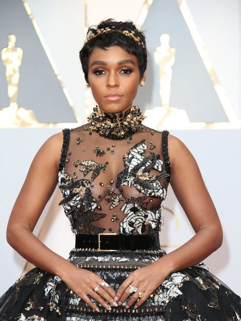 Janelle Monáe's gold headband adds an ethereal look to her fairytale moment.