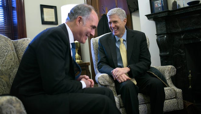 Supreme Court nominee Neil Gorsuch (R) meets with Democratic Sen. Robert Casey on Thursday.