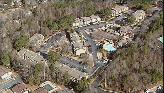 A maintenance worker at Walton Crossing Apartments in Austell, Ga., found a woman and her three children dead Jan. 27, 2015, when he entered the apartment.