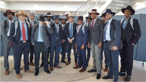 The Tar Heels and their lids, designed by Shea Rush (tan hat, blue tie in the center).