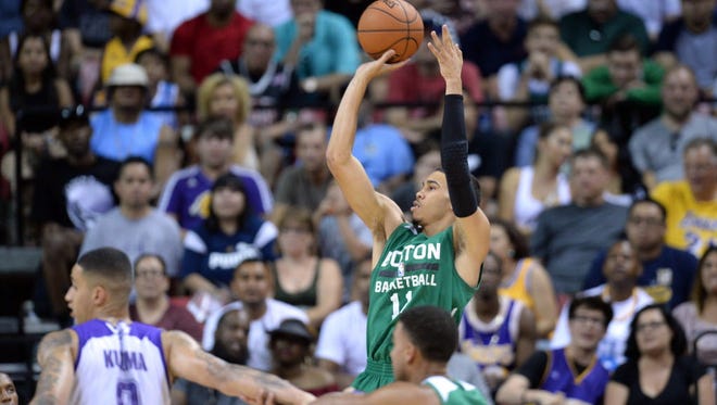 Boston Celtics forward Jayson Tatum (11) shoots against the Los Angeles Lakers during the first half at Thomas & Mack Center.