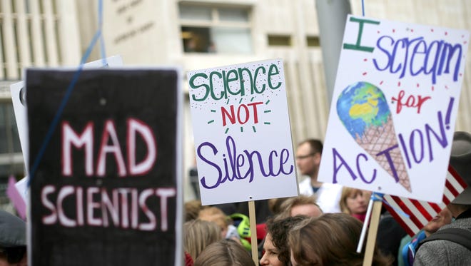 People gather prior to the start of the March for Science in London.