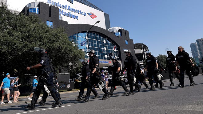Charlotte Mecklenburg Police Department deploy outside of Bank of America Stadium prior to the game between the Carolina Panthers and the Minnesota Vikings on Sept. 25, 2016 in Charlotte, N.C.