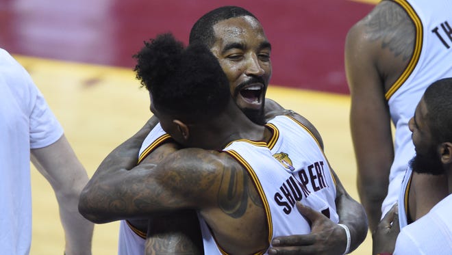 Cleveland Cavaliers guard J.R. Smith (5) celebrates with guard Iman Shumpert (4) after defeating the Golden State Warriors 115-101 in Game 6 of the NBA Finals at Quicken Loans Arena.