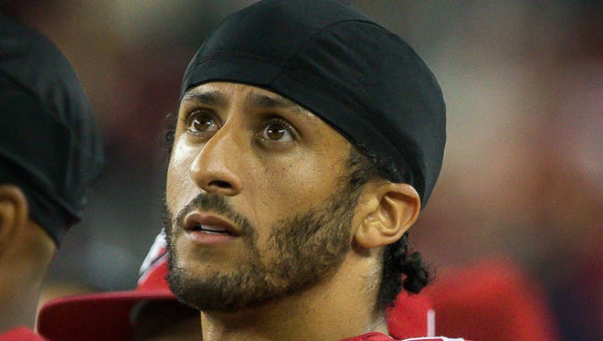 San Francisco 49ers quarterback Colin Kaepernick (7) on the sideline against the Los Angeles Rams during the fourth quarter at Lev'i's Stadium.