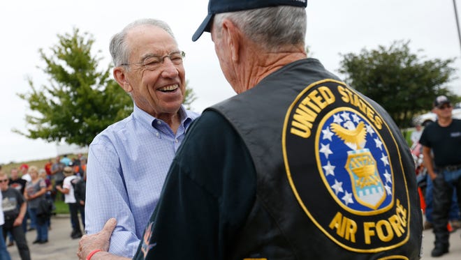 Sen. Chuck Grassley talks with riders Saturday, Aug. 27, 2016, before they take off for the Roast and Ride in Des Moines.
