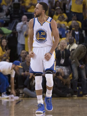 Golden State Warriors guard Stephen Curry (30) celebrates against the Portland Trail Blazers during the third quarter in game one of the first round of the 2017 NBA Playoffs at Oracle Arena.