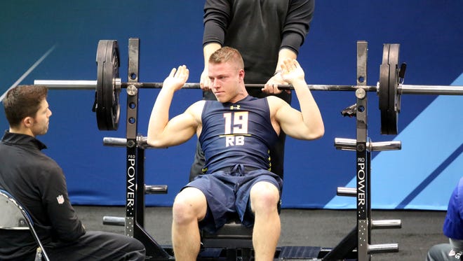 Stanford running back Christian McCaffrey performs in the bench press at the 2017 NFL football scouting combine Thursday, March 2, 2017, in Indianapolis.