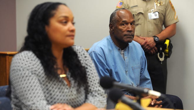 O.J. Simpson listens as his daughter Arnelle Simpson during his parole hearing at Lovelock Correctional Center.