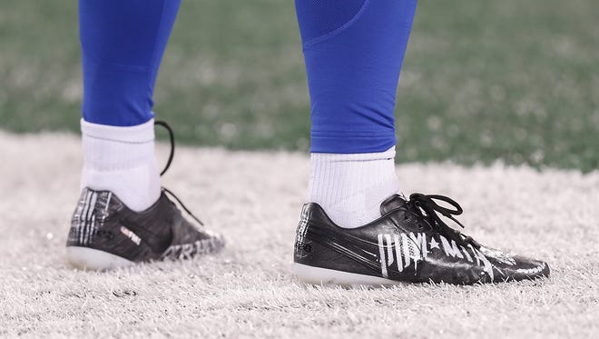 Shoes of Indianapolis Colts punter Pat McAfee (1) before facing off against the New York Jets at MetLife Stadium in East Rutherford, N.J., on Monday, Dec. 5, 2016.