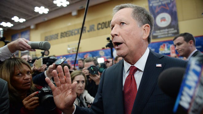 Kasich does an interview after the Republican debate at the University of Colorado in Boulder on Oct. 28, 2015.