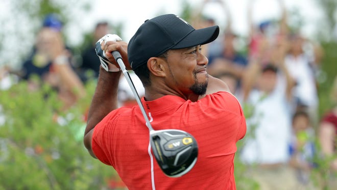 Tiger Woods watches his tee shot during the final round at the Hero World Challenge golf tournament, on Dec. 4, 2016, in Nassau, Bahamas.