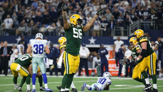 Linebacker Julius Peppers (56) celebrates after the Packers beat the Cowboys on a last-second field goal.