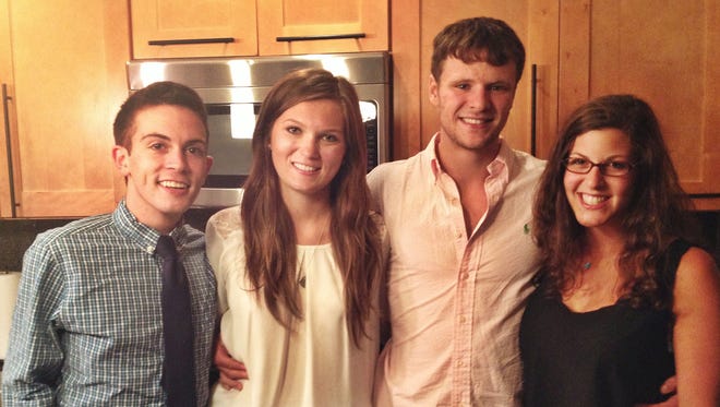 From left, Chris Colloton, Maggie Feazell, Otto Warmbier and Alex Abel. Colloton knew Warmbier since preschool. The community of Wyoming, Ohio, gathers Thursday, June 22, 2017, to mourn Warmbier, who died Monday, June 19, 2017.