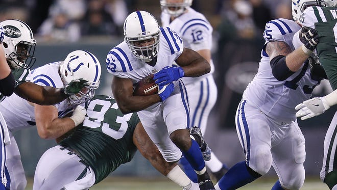 Indianapolis Colts running back Frank Gore (23) picks up 6 yards on a carry against the New York Jets during the third quarter at MetLife Stadium in East Rutherford, N.J., on Monday, Dec. 5, 2016.